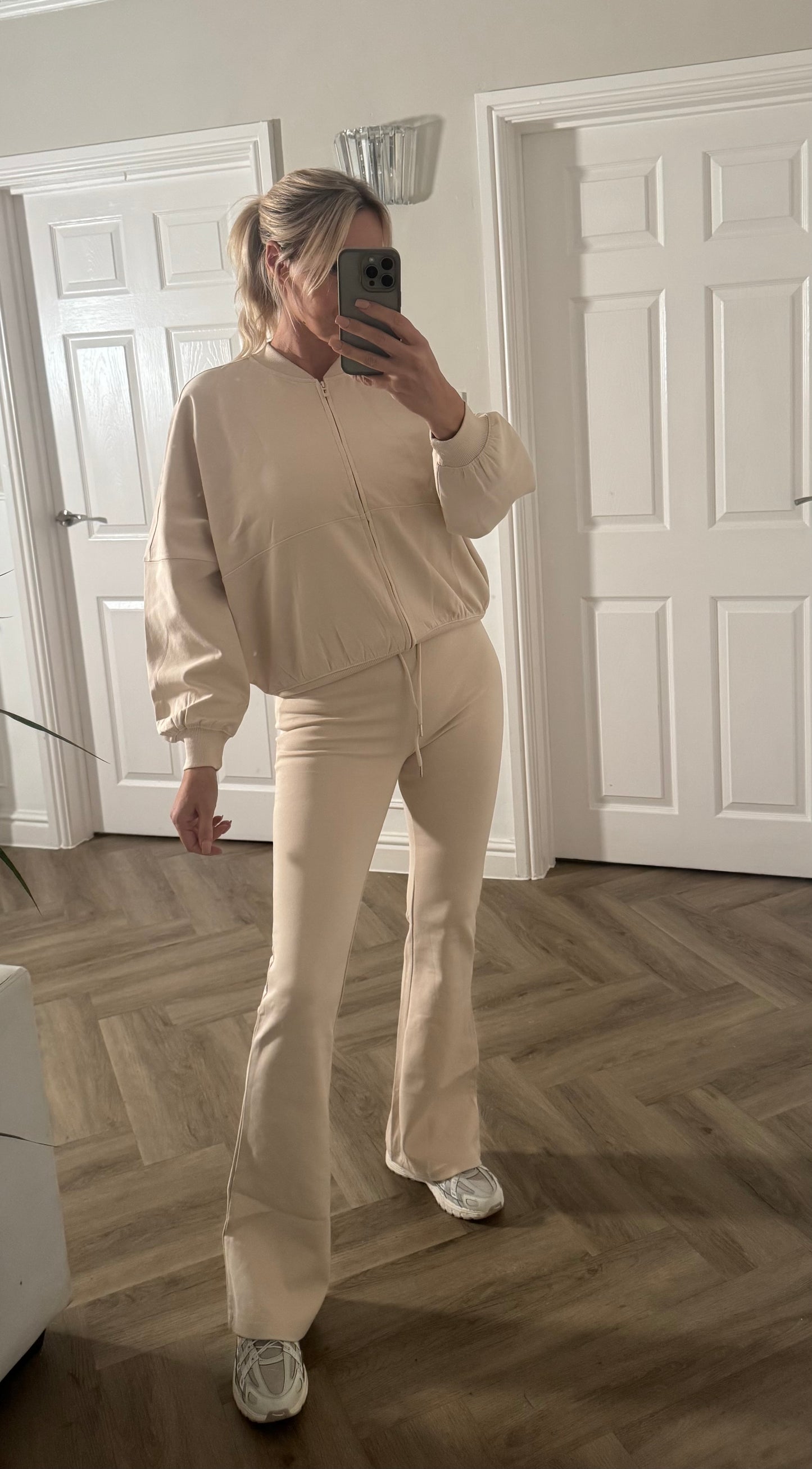 Oversized bomber with flared trousers